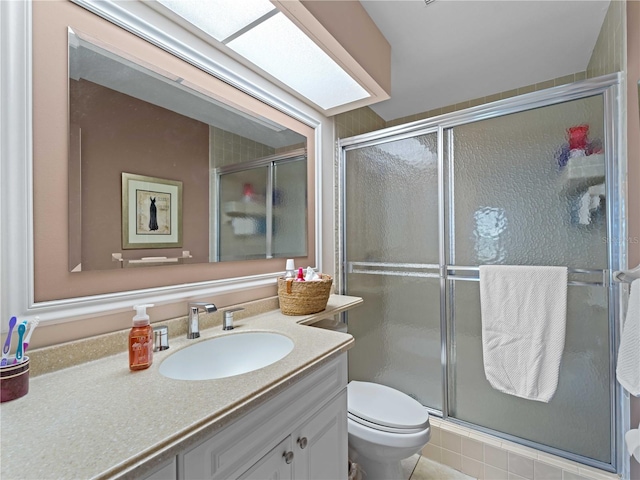 bathroom featuring tile patterned flooring, vanity, toilet, and an enclosed shower