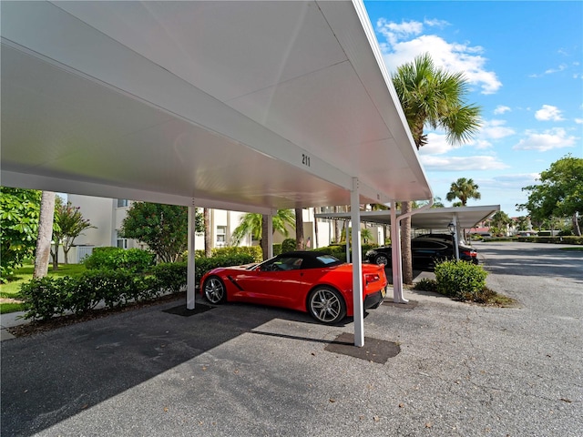 view of vehicle parking featuring a carport