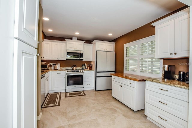 kitchen featuring white cabinetry and stainless steel appliances