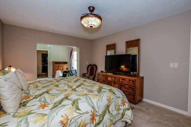 bedroom featuring a textured ceiling