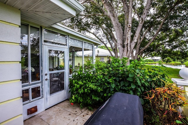 view of patio with a sunroom