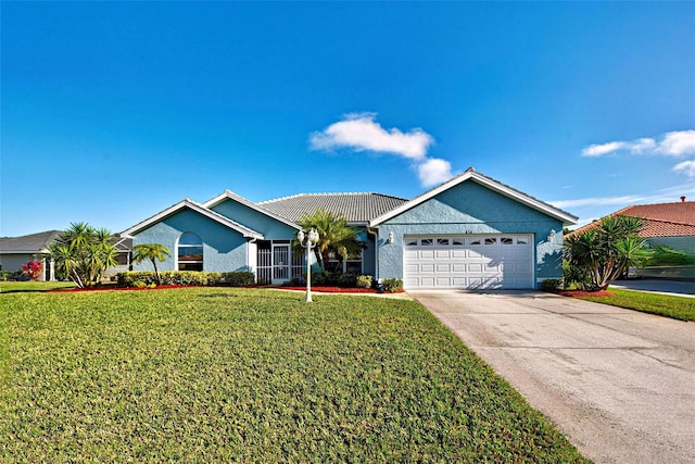 ranch-style house featuring a garage and a front lawn