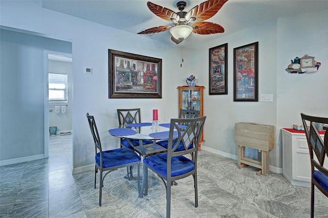 dining space featuring ceiling fan