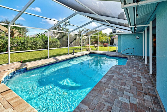 view of swimming pool with a lanai, pool water feature, and a lawn