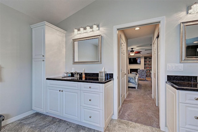 bathroom featuring ceiling fan and vanity