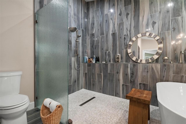 bathroom with shower with separate bathtub, tile walls, and toilet