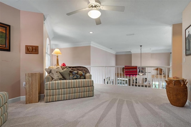 carpeted living room featuring crown molding and ceiling fan