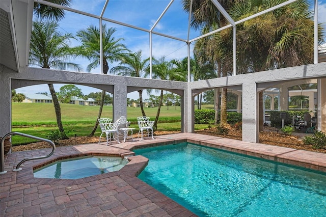 view of swimming pool with glass enclosure, a yard, a patio, and an in ground hot tub