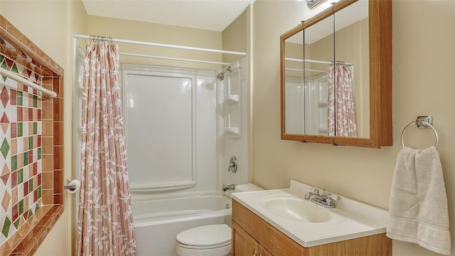 full bathroom featuring shower / tub combo, vanity, and toilet