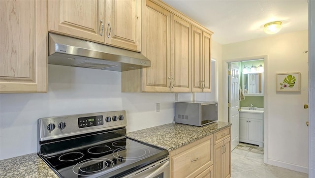 kitchen featuring light tile patterned flooring, light stone counters, light brown cabinetry, sink, and stainless steel range with electric cooktop