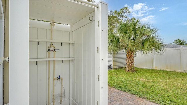 entrance to property featuring a lawn