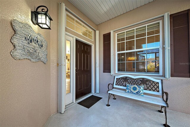 property entrance featuring a porch