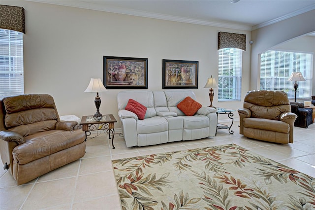 living room with light tile patterned floors and ornamental molding