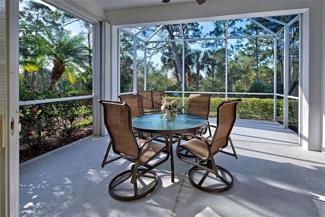 sunroom / solarium featuring ceiling fan