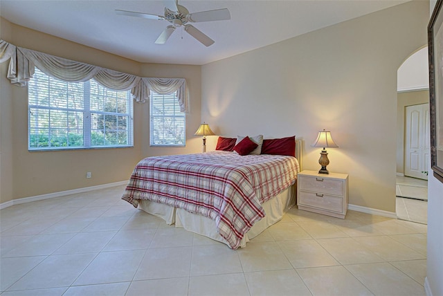 tiled bedroom with ceiling fan