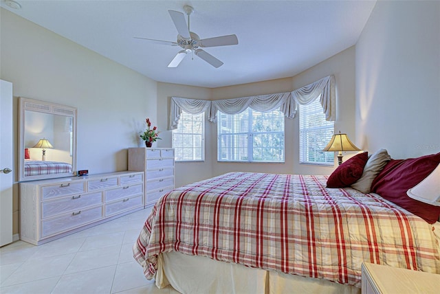 tiled bedroom with ceiling fan