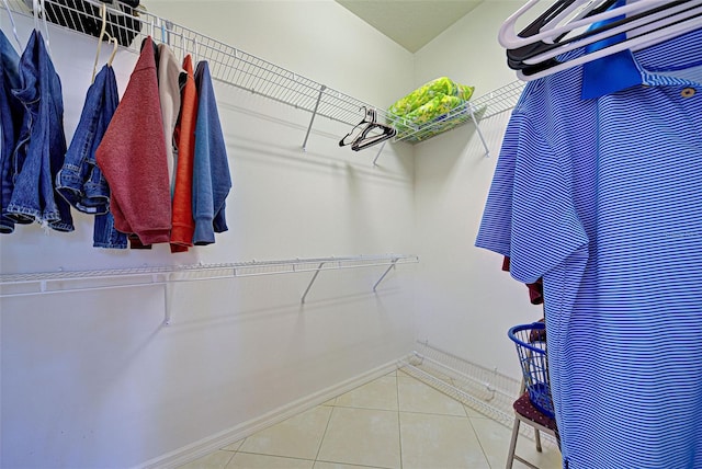 spacious closet featuring tile patterned flooring