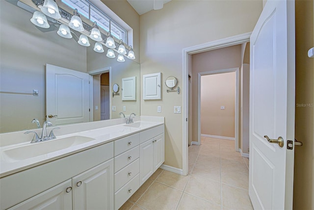 bathroom featuring tile patterned flooring and vanity