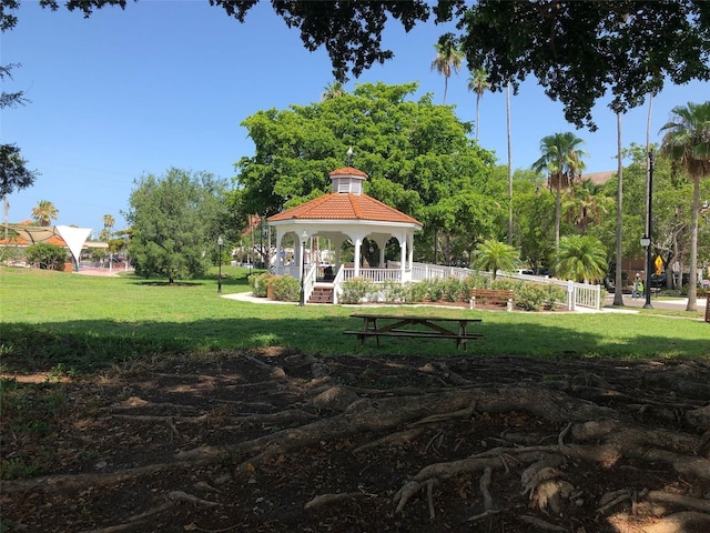 surrounding community with a gazebo and a yard