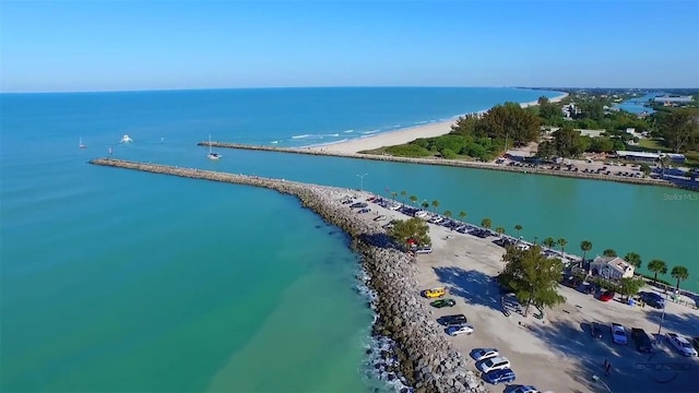 drone / aerial view with a water view and a view of the beach