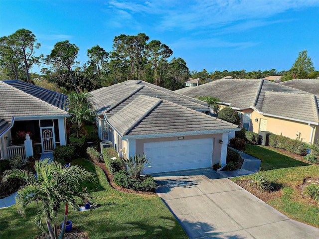 1586 Monarch Dr Unit 1586, Venice, FL 34293 - ranch-style house featuring a tile roof, a front lawn, a garage, concrete driveway, and stucco siding