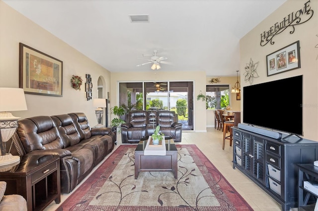 living room with light tile patterned flooring and ceiling fan