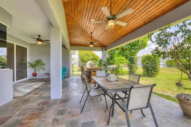 view of patio featuring ceiling fan and a grill