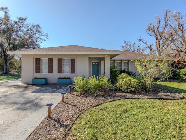 ranch-style home with a front yard