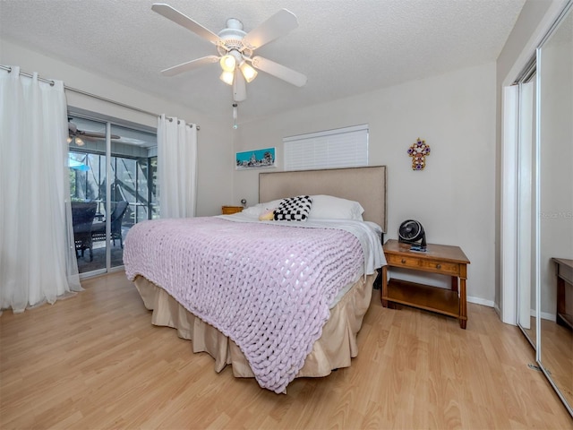 bedroom featuring ceiling fan, a textured ceiling, access to outside, and light hardwood / wood-style flooring