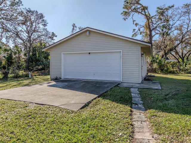 garage featuring a lawn