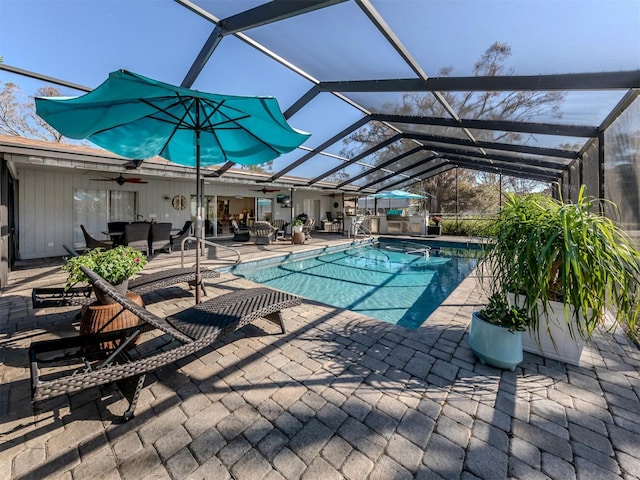 view of pool featuring a patio area and glass enclosure