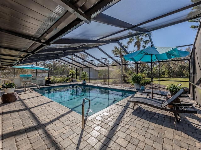 view of pool with a patio and a lanai