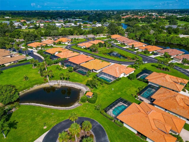 birds eye view of property featuring a residential view and a water view