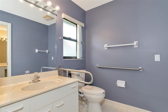 bathroom featuring baseboards, visible vents, toilet, tile patterned floors, and vanity