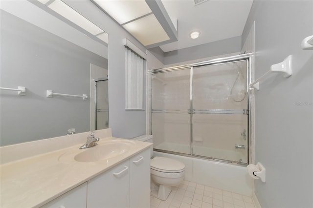 full bath featuring visible vents, toilet, tile patterned floors, combined bath / shower with glass door, and vanity