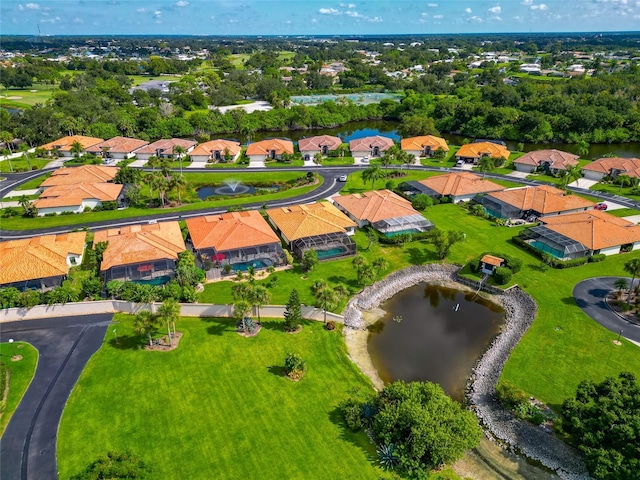 aerial view with a water view and a residential view