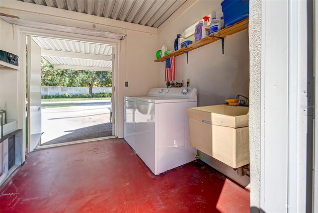 laundry room featuring independent washer and dryer and sink