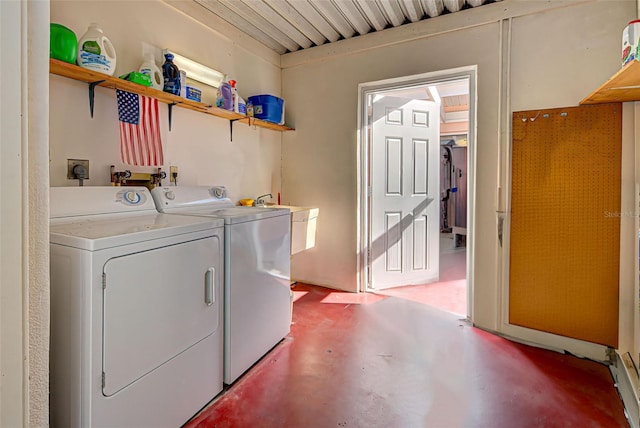 washroom with separate washer and dryer