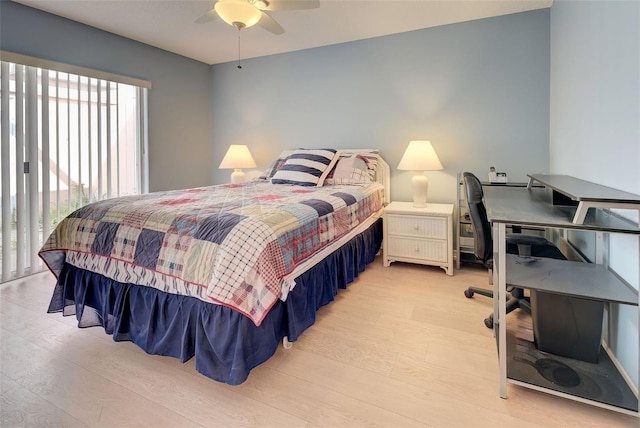 bedroom with light wood-type flooring and ceiling fan