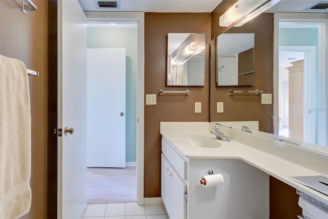 bathroom featuring tile patterned flooring and vanity