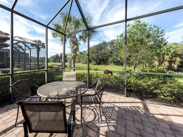 view of patio / terrace with a lanai