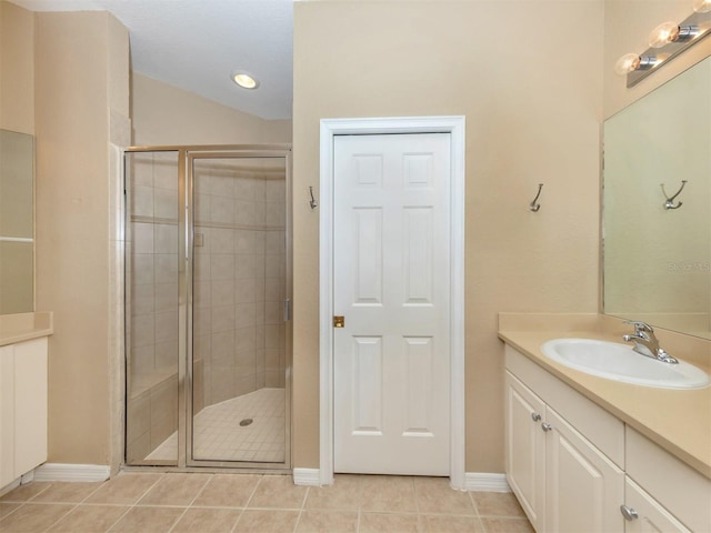 bathroom with vanity, tile patterned flooring, and an enclosed shower