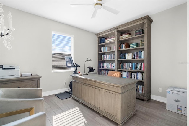 office featuring ceiling fan and light hardwood / wood-style flooring