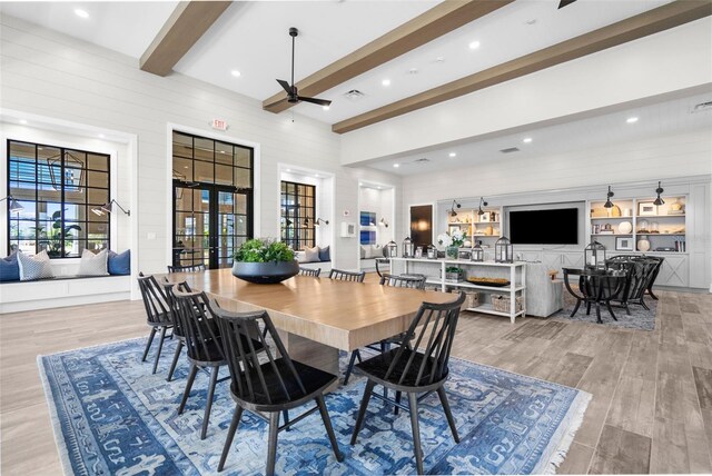 8209 Redonda Loop, Lakewood Ranch, FL 34202 - dining space with beam ceiling, french doors, light wood finished floors, a high ceiling, and ceiling fan