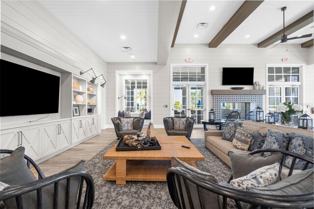 8209 Redonda Loop, Lakewood Ranch, FL 34202 - living room featuring a ceiling fan, wood finished floors, beamed ceiling, and visible vents