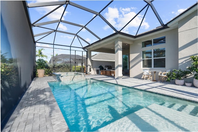 view of swimming pool featuring glass enclosure, area for grilling, a patio area, and grilling area