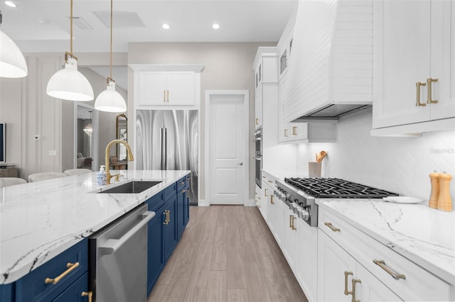 kitchen featuring white cabinets, blue cabinets, sink, and stainless steel appliances