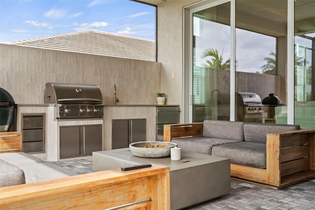 8209 Redonda Loop, Lakewood Ranch, FL 34202 - view of patio with an outdoor kitchen, area for grilling, and outdoor lounge area