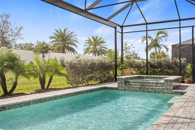8209 Redonda Loop, Lakewood Ranch, FL 34202 - pool with glass enclosure, a fenced backyard, and an in ground hot tub