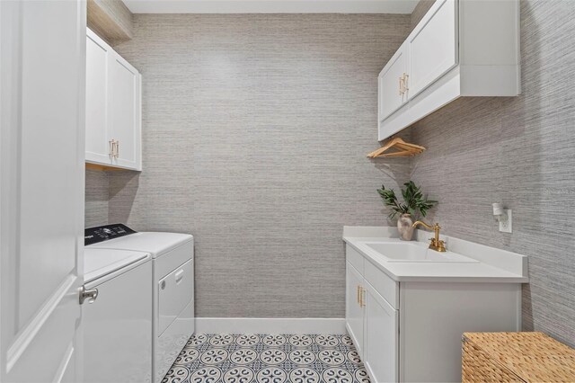 8209 Redonda Loop, Lakewood Ranch, FL 34202 - laundry room with light tile patterned floors, baseboards, washing machine and clothes dryer, a sink, and cabinet space